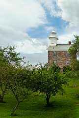 Great Captain Island Lighthouse Among Trees on Hilltop